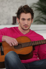 young with Spanish guitar