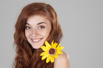 Obraz na płótnie Canvas Portrait of a smiling red haired girl