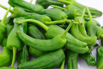 Green peppers on white background