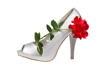Obraz na płótnie Canvas Silver women's heel shoe with red rose with clipping path.