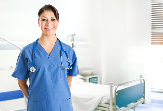 Smiling nurse in a hospital room