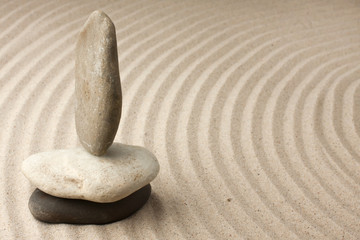 Three stones in the sand