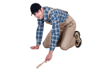 Painter kneeling