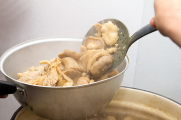 Mushrooms cook in a pan
