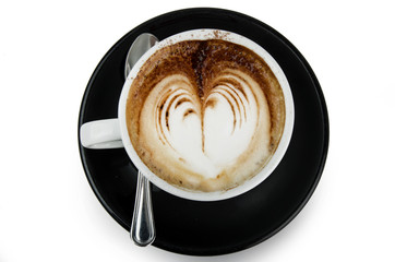 cup of cappuccino with artistic cream decoration heart