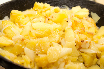 Roast the potatoes in a pan