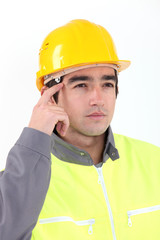A pensive construction worker.