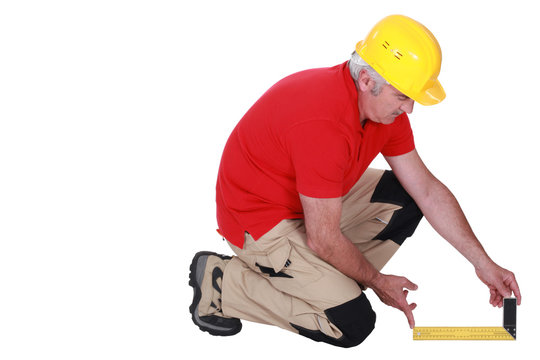 Middle-aged carpenter using set-square