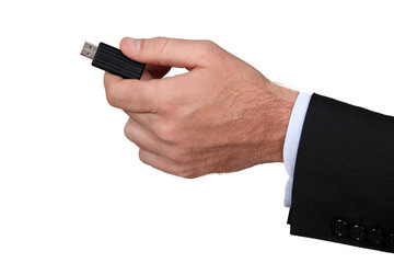 businessman holding a flash driver