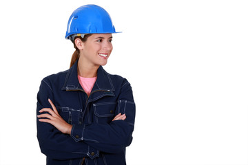 Female builder stood with folded arms