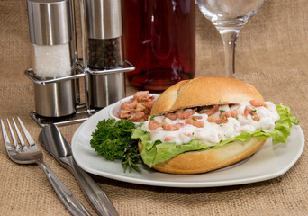 Shrimps on a roll (wooden background)
