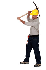 craftsman striking with his pick
