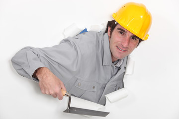 A mason with a trowel.