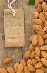 nuts almond fruit and tag  label on wood