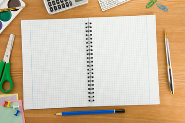 back to school concept and supplies on wood