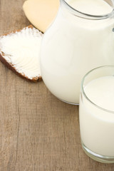 milk products and cheese on wood