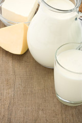 cheese and milk products isolated on wood