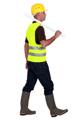 Tradesman walking on a building site
