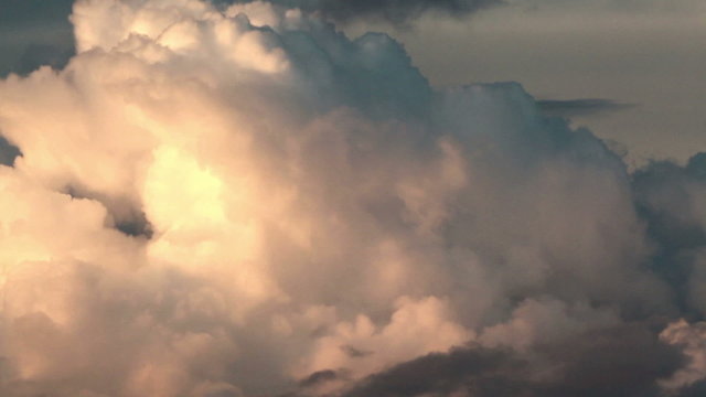 Formation of large cumulonimbus clouds at sunset