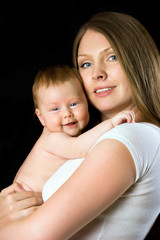 portrait of angelic baby and his mother