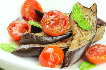 Oven baked egglant with tomatoes and mint