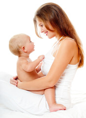 Young mother hugging baby