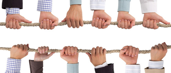 Hands holding rope, teamwork concept