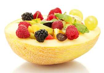fresh fruits salad in melon, isolated on white