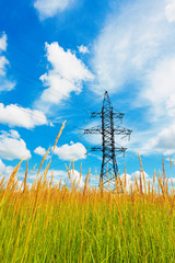 High voltage lines and cloudy sky