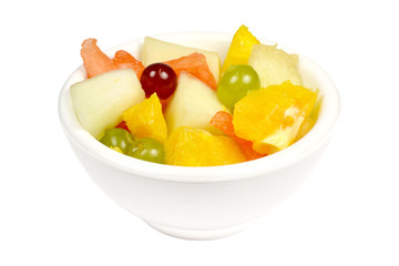 Fruit salad in a bowl on a white background.