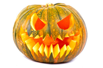 Halloween pumpkin with scary face over white background