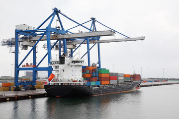 Cargo ship with lot of containers in Copenhagen seaport