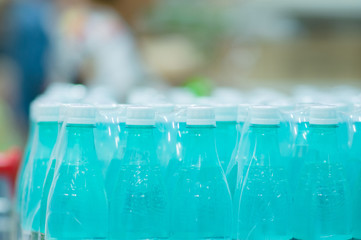 Naklejka na ściany i meble Bottles with fresh water in supermarket