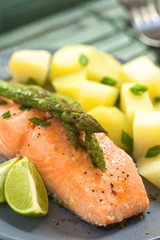 Baked salmon fillet with asparagus, lime and potatoes