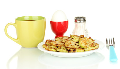 Fried zucchini with eggs and coffee for breakfast isolated