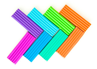 Children bright plasticine isolated on white