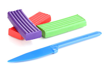 Children bright plasticine with stack isolated on white