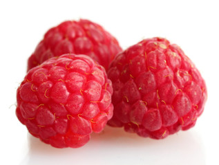 ripe raspberries isolated on white