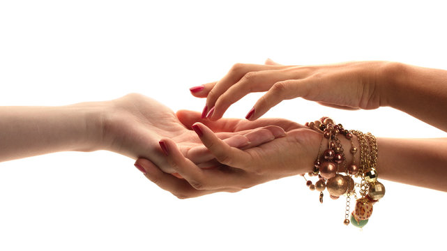 reading the lines hand in a woman's hands isolated on white