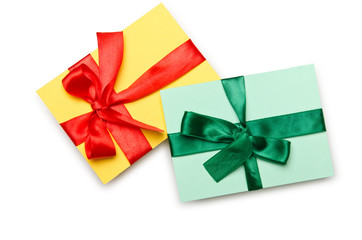 Envelope with colourful ribbon on white