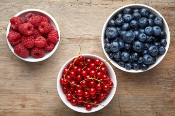three bowls of berries