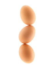 Three eggs balancing in a stack  - isolated on white