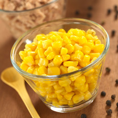 Sweet corn grains and tuna in glass bowls