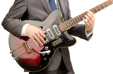 Fototapeta na wymiar Guitar player in business suit on white