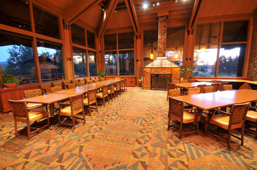 Dinning room with tables, chairs and fireplace