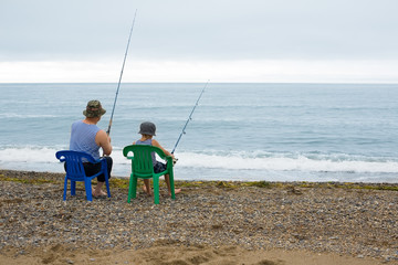 Grandfather and grandson go fishing