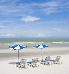 summer tropical beach with blue sky with umbrella and chair