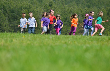 Obraz premium happy kids group have fun in nature