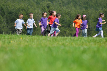 happy kids group  have fun in nature