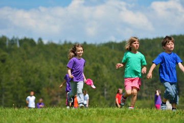 happy kids group  have fun in nature